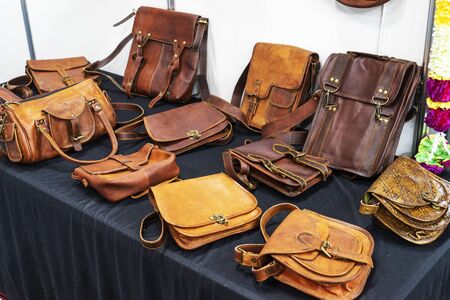 men's, women's bags made of genuine leather handmade lie on the table