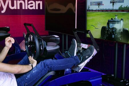 BAKU, AZERBAIJAN - MAY 17, 2016: Public race car Simulator on Ferrari F1 with large audience at Expo...