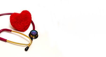 Red stethoscope and red heart on a white background.Concept of medicine and health.