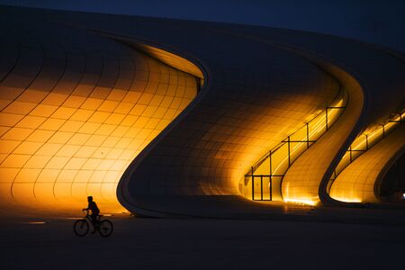 BAKU, AZERBAIJAN - SEPTEMBER 20, 2019: The Heydar Aliyev Center at night. It is a building complex in Baku in Azerbaijan, noted for its distinctive architecture and flowing, curved style.のeditorial素材