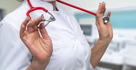 A female doctor with a stethoscope is in the surgical ward.