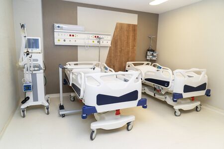 Hospital room with beds and comfortable medical equipped in a modern hospitalの写真素材