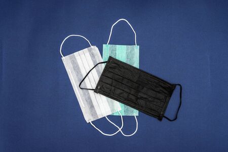 Medical mask protective , mask on blue background disposable surgical face mask cover the mouth and...