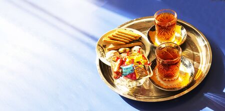 Tea in East Azerbaijan national Cup armud, with sweets on the tableの写真素材