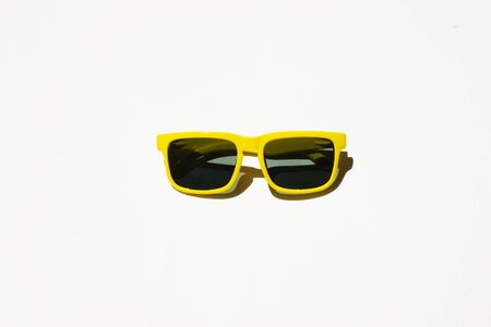 yellow sunglasses pattern on white pastel background. Minimal summer concept. Isometric print.の写真素材