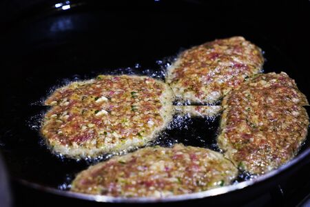juicy delicious meat cutlets in a frying Pan are Fried On the Stove in oil