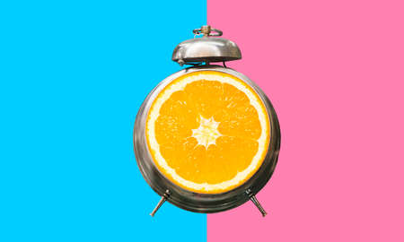 Summer time concepts idea with alarm clock on colorful background.holiday decoration images.の写真素材