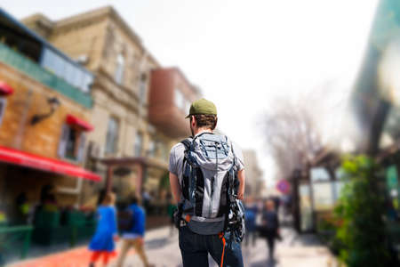 Young independent tourist-tourist traveling alone in the Old town of the Fortress of Baku, Azerbaijan for holidaysの写真素材