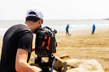 Videographer are taking pictures and video of the ocean views, Sea and island background.