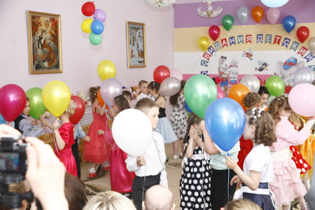 Moscow, Russia-April 17, 2014: children dancing and playing during a party in kindergartenのeditorial素材