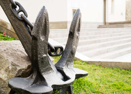 black anchor monument stands on the street