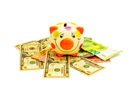 Piggybank with banknote on whiteの写真素材
