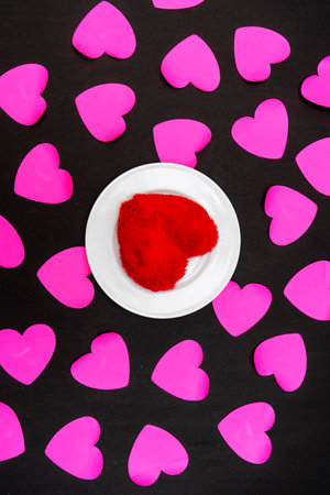 happy valentine's day background. red heart on black paper. top view.の写真素材