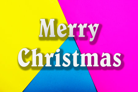 Inscription Merry Christmas on a multicolored backgroundの写真素材
