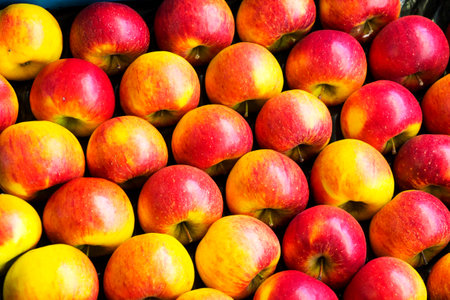 Yellow red ripe apples on the store counter for sale. background, texture
