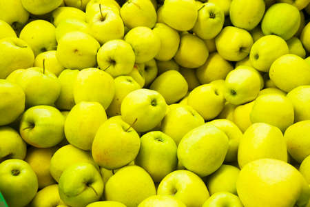 many green apples beautifully laid out on the market on the wind.Organic products.Farmers...