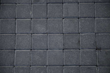 Abstract background of old cobblestone pavement close-upの写真素材