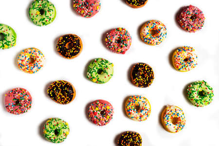 Set of various colorful donuts isolated on white background. Top viewの写真素材
