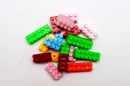 Toy colorful plastic blocks isolated on white background