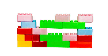 Toy colorful plastic blocks isolated on white backgroundの写真素材