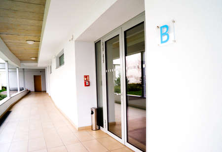outdoor empty corridor with garden in the modern office building