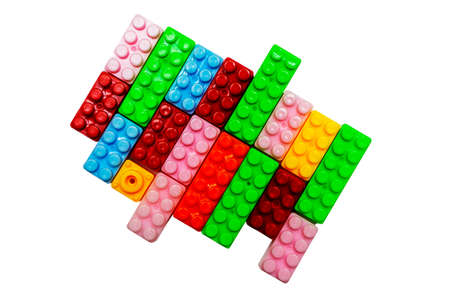 Toy colorful plastic blocks isolated on white backgroundの写真素材