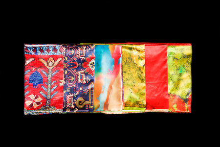 colorful Azerbaijani, Turkish Oriental beautiful scarves with pictures of natural silk on a black background.の写真素材