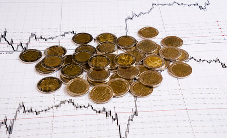 Business diagram on financial report with coinsの写真素材