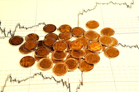 Business diagram on financial report with coinsの写真素材