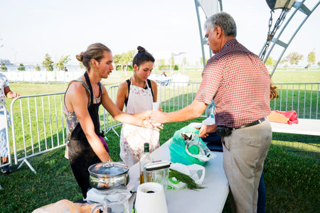 a guy and a girl show a master class on cooking vegetarian dishes.のeditorial素材