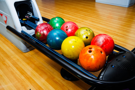 Stand with colorful bowling balls in club no people.の写真素材