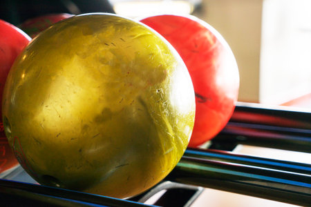 Stand with colorful bowling balls in club no people.の写真素材
