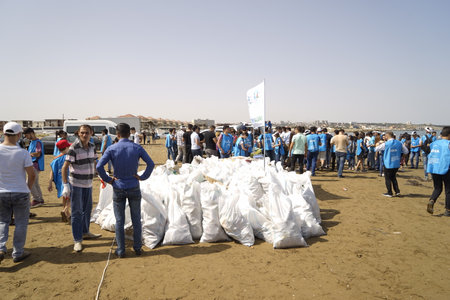 BAKU, AZERBAIJAN- JUNE 20, 2019 : young boys and girls, students clean up garbage on the seashore, on the beach. Environmental protectionのeditorial素材