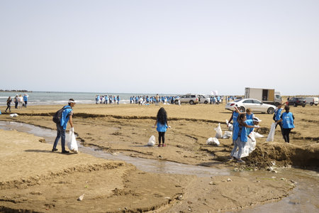 BAKU, AZERBAIJAN- JUNE 20, 2019 : young boys and girls, students clean up garbage on the seashore, on the beach. Environmental protection.のeditorial素材