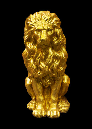beautiful gilded lion statue on a black background. Works of artの写真素材