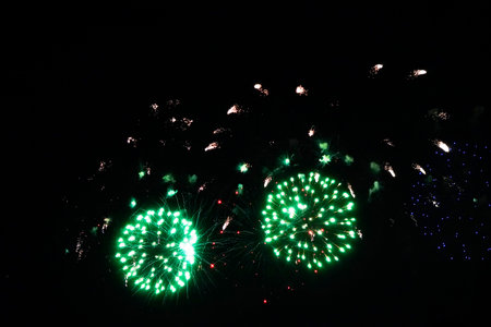 Colorful fireworks over dark sky, displayed during a celebration.の写真素材