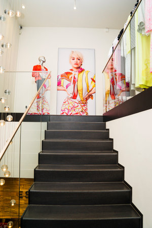 Interior of fashionable women's clothes store with clothes racks.のeditorial素材