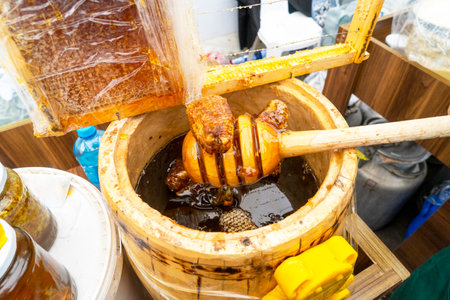 Natural sweet healthy honey in wooden barrels for sale. Healthy eating. Healthy lifestyle.の写真素材