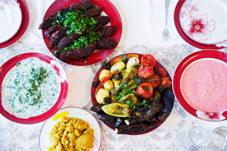 A variety of vegetarian dishes on the plates on the table.の写真素材