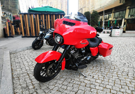 BAKU, AZERBAIJAN - JULY 5, 2023: A red Harley Davidson motorcycle stands on the streetのeditorial素材