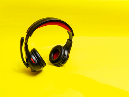 Wireless Over-Ear full size Headphones, Black leather isolated on yellow background