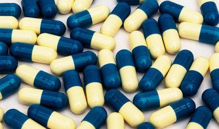 A background of white and blue vitamins, tablets. Medication. Antibiotics, health concepts
