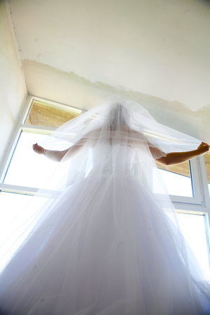 the bride and groom close up the house, walking in the city hdの写真素材