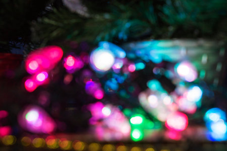 christmas background, image blur colorful bokeh defocused lights decoration on christmas treeの写真素材
