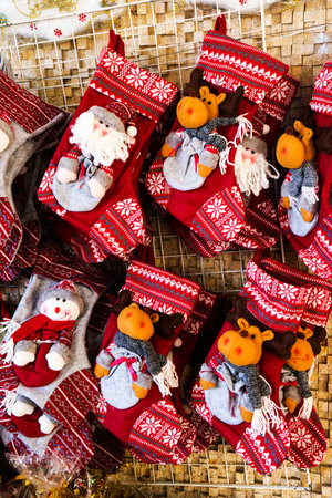 Christmas decoration stocking and toys hanging over rustic stone backgroundの写真素材