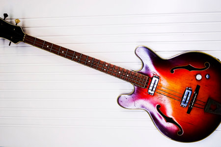 red six-stringed electric guitar isolated on white backgroundの写真素材