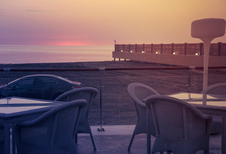 Pier in the sea mist at golden sunriseの写真素材