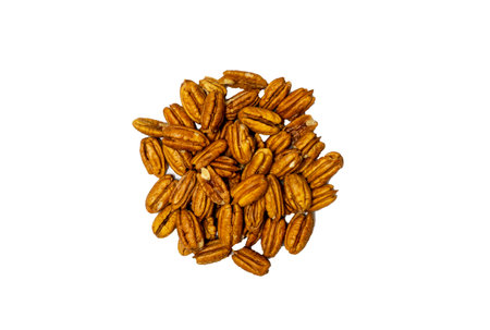 Pile Pecan nuts isolated on white background. Heap shelled Pecans nut closeup. Tasty raw organic food and healthy snack,の写真素材