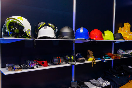 Multi-colored protective helmets for engineers, builders, workers of the oil and gas industry, for handymen in the shop window, at exhibitions. Compliance with safety regulations.の写真素材