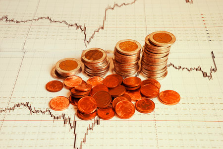 Business diagram on financial report with coinsの写真素材